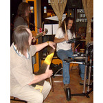 Bobby Fowler plays the Saw with other Live musicians