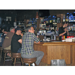 The Cork Lounge offers a full menu, and has a full bar right next to the stage!